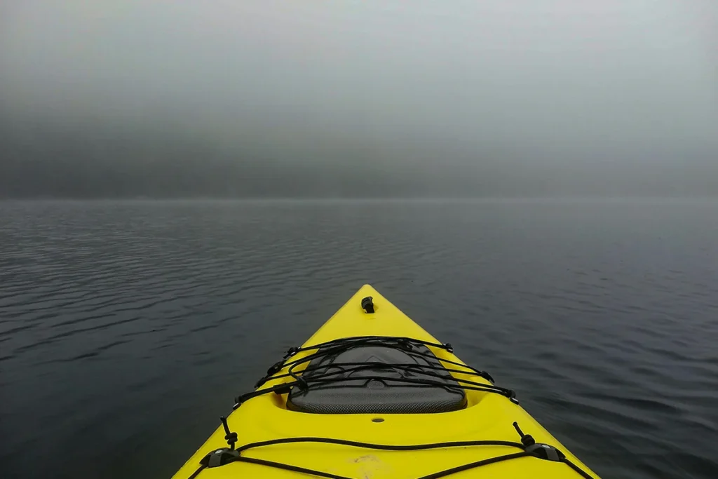 Yellow kayak on the river photo